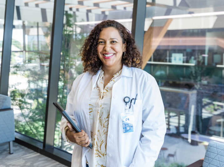 Female doctor smiles for hospital publicity photo