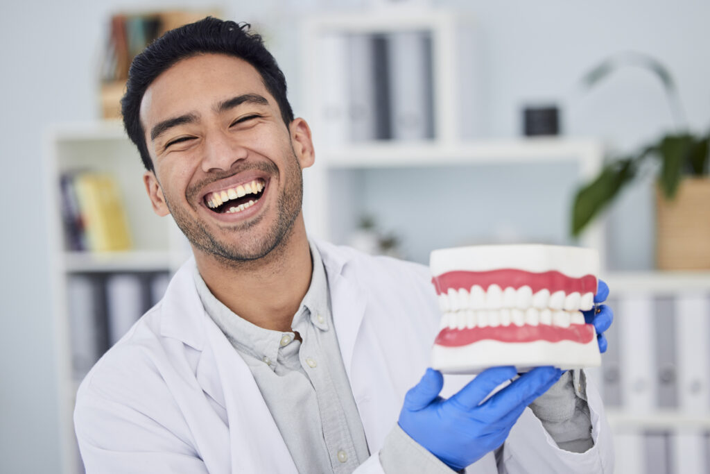 Happy asian man, dentist and teeth for dental care, veneers or healthcare at hospital. Portrait of male person or medical expert with big smile in happiness for oral, mouth and gum health at clinic