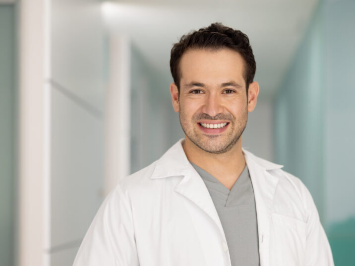 Portrait of a happy doctor smiling at the hospital