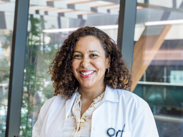 Female doctor smiles for hospital publicity photo