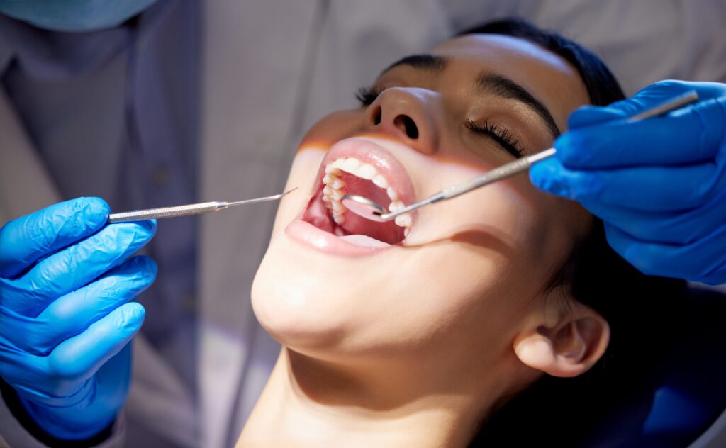 Face,,Hands,And,Tools,With,Woman,At,Dentist,For,Oral
