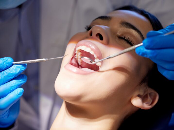 Face,,Hands,And,Tools,With,Woman,At,Dentist,For,Oral