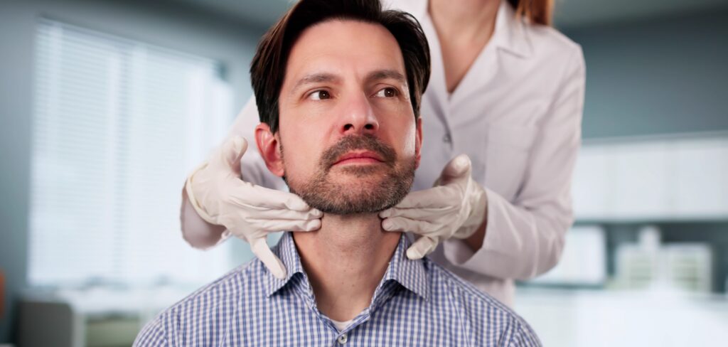 The,Doctor,Carefully,Palpates,The,Thyroid,Gland,During,Physical,Exam