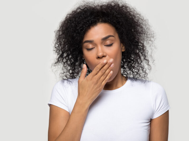 Tired,Funny,Drowsy,African,American,Woman,Yawning,Isolated,On,White